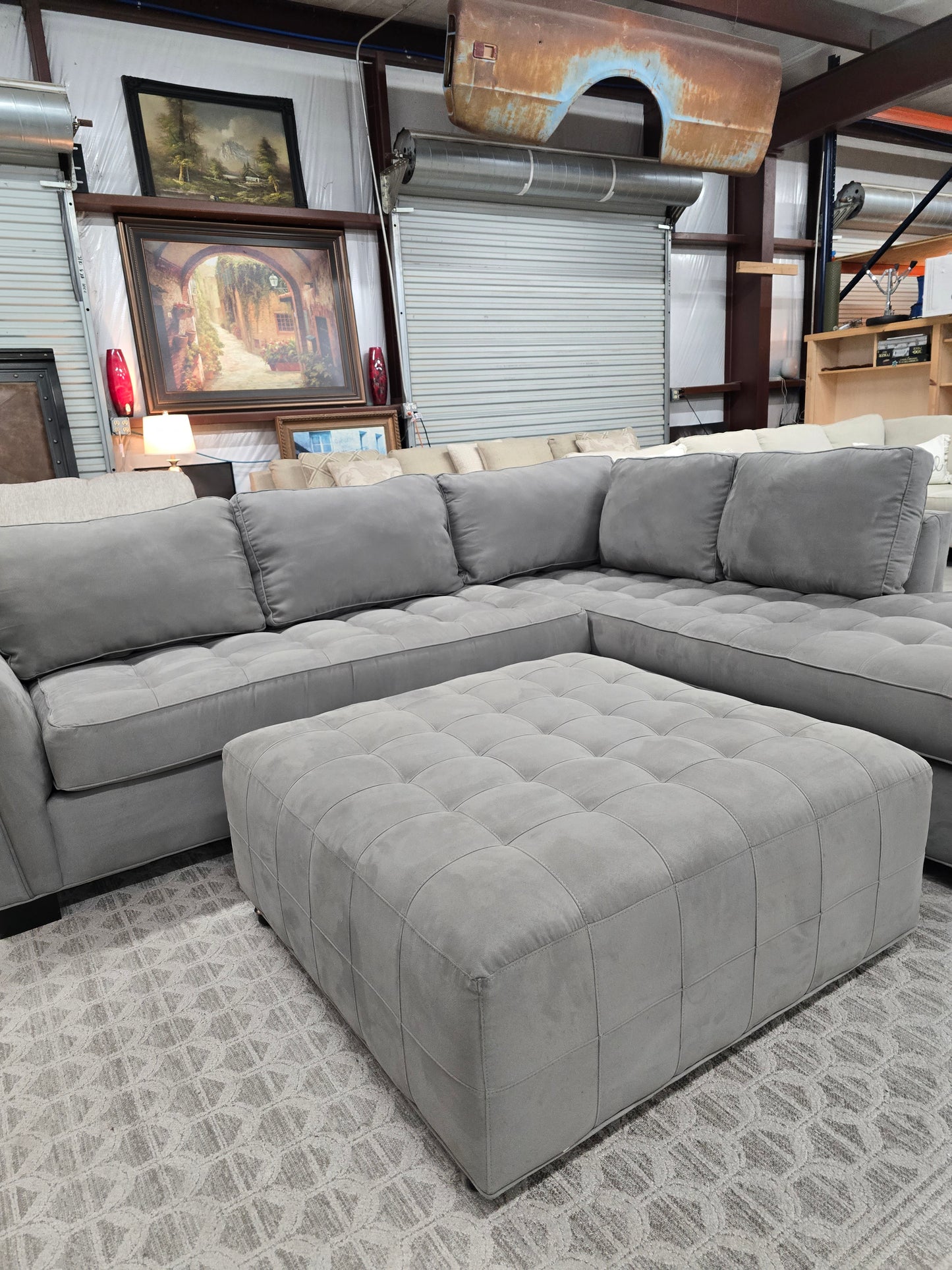 Gray Sectional Couch with Rolling Ottoman – Rooms To Go