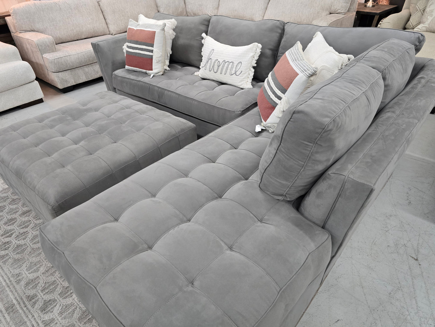 Gray Sectional Couch with Rolling Ottoman – Rooms To Go