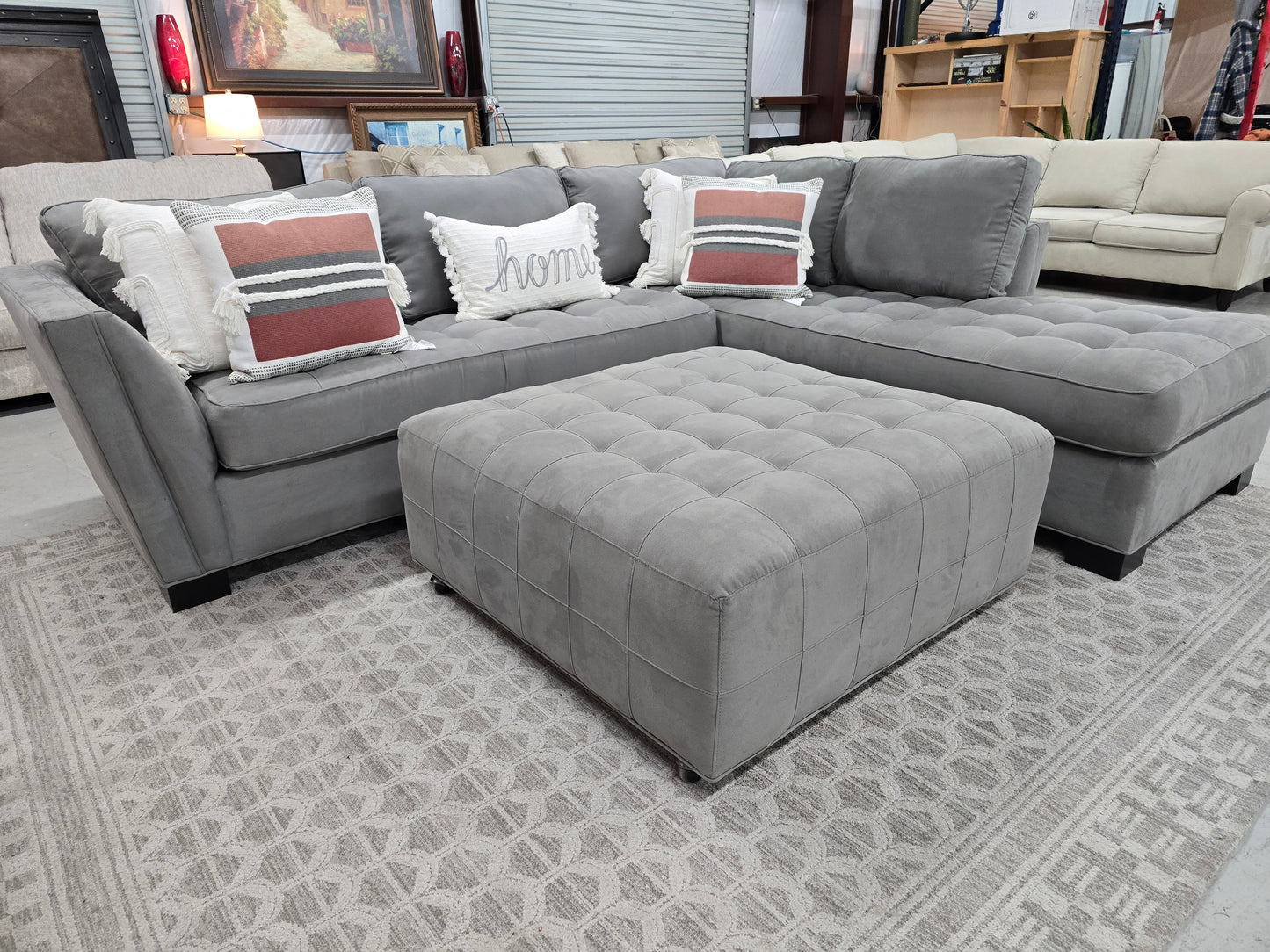 Gray Sectional Couch with Rolling Ottoman – Rooms To Go