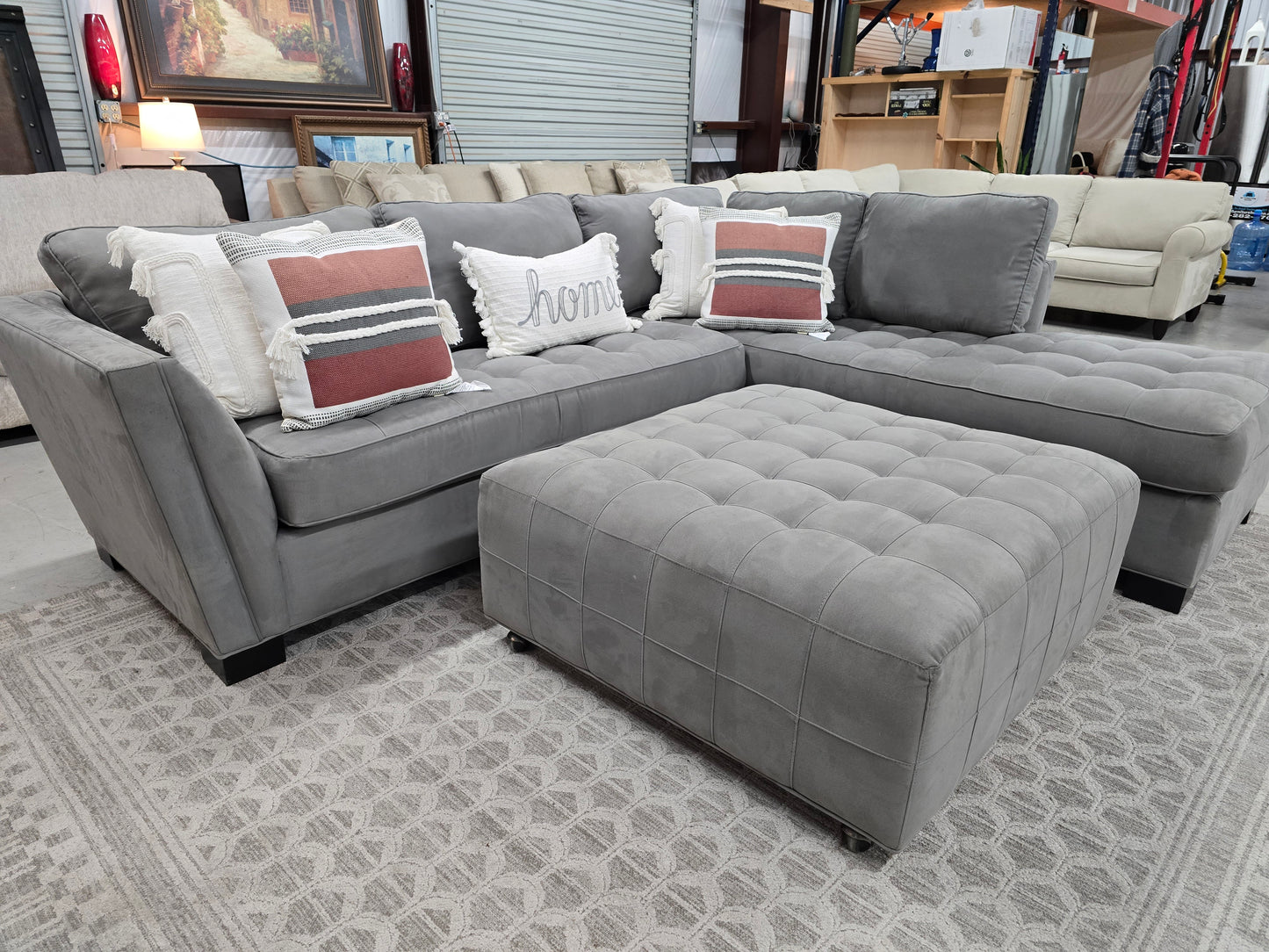 Gray Sectional Couch with Rolling Ottoman – Rooms To Go