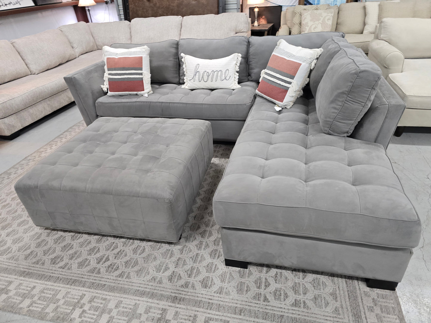 Gray Sectional Couch with Rolling Ottoman – Rooms To Go