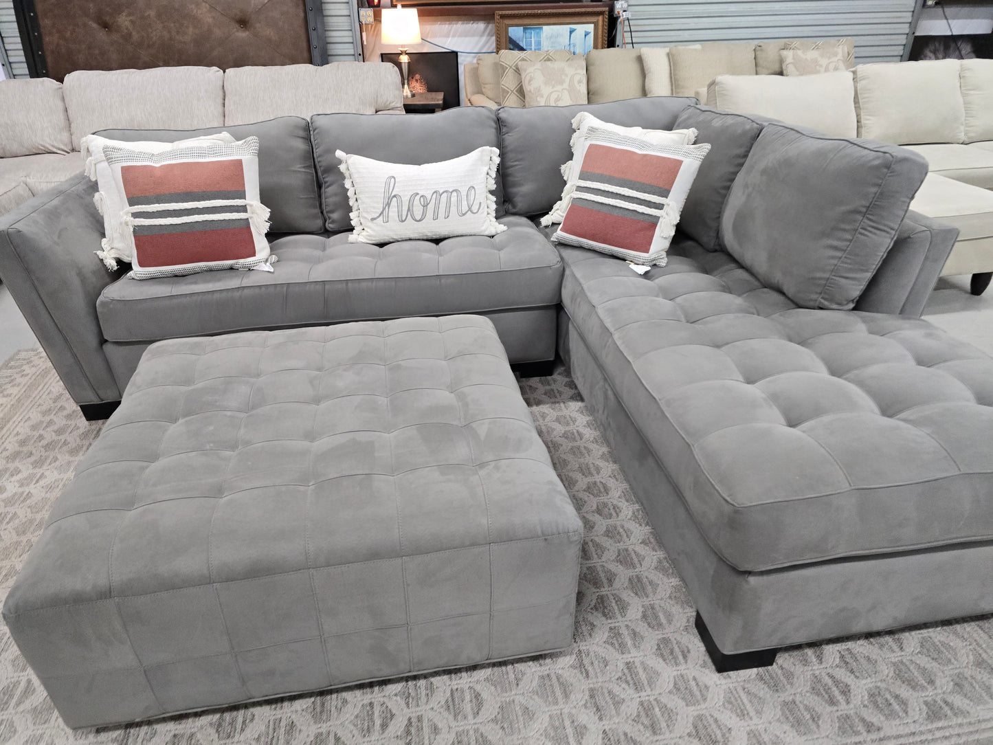Gray Sectional Couch with Rolling Ottoman – Rooms To Go